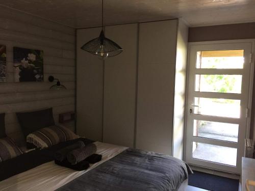 a bedroom with a bed and a window at Vulkan’O in La Plaine des Cafres