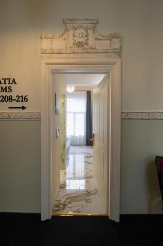 a door leading into a room with a hallway at Modern Revival Luxury Hotel in Thessaloniki