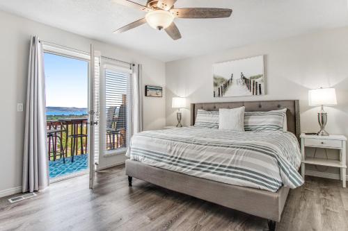 a bedroom with a bed and a ceiling fan at Bear Lake Blue in Garden City