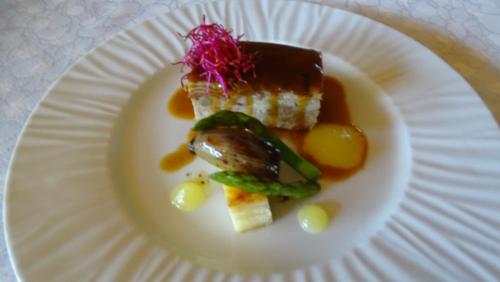 a white plate with a piece of food on it at Hotel Restaurante La Glorieta in La Seu d'Urgell