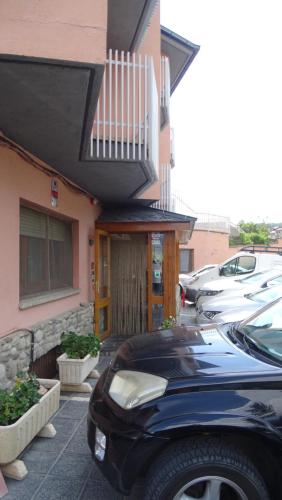 a car parked in front of a building at Hotel Restaurante La Glorieta in La Seu d'Urgell