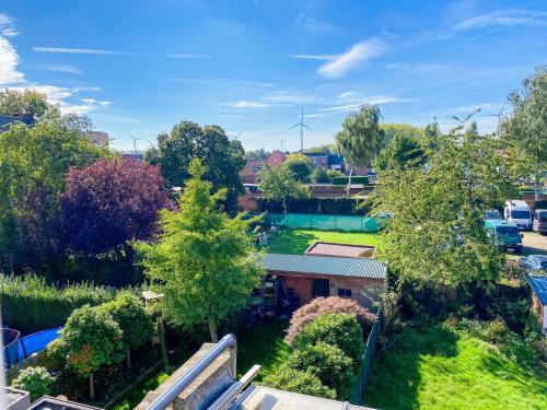 an aerial view of a park with trees and a building at Big Sunset 3 Bedroom House with a Garden in Antwerp