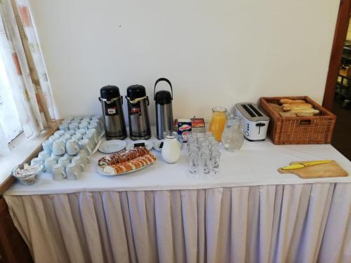 a table with food and drinks on top of it at Penzion U Skály in Kytlice