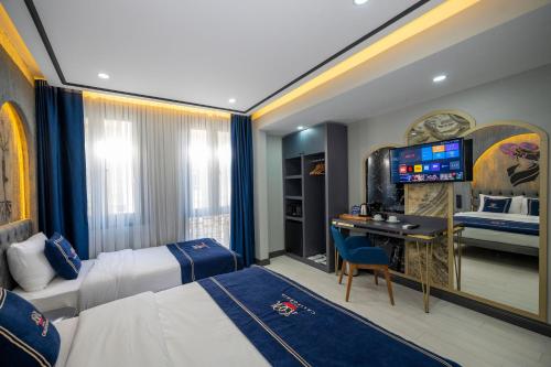A bed or beds in a room at Hotel California