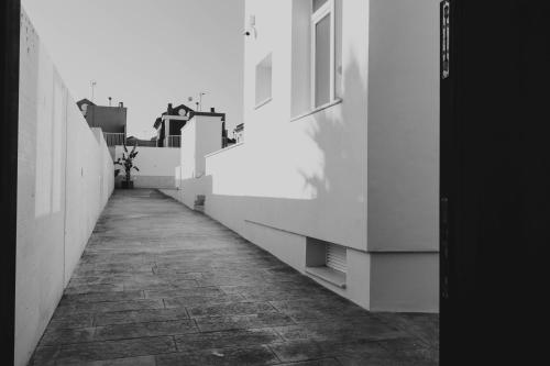 a hallway of a building with a stone walkway at Apartamentos SubUp in Cabo de Palos