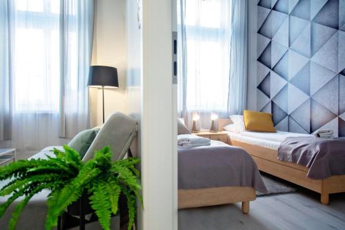 Posteľ alebo postele v izbe v ubytovaní Apartment Cappuccino