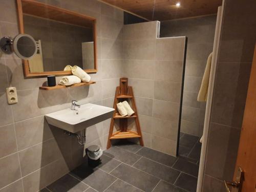 a bathroom with a sink and a shower at Apart 14 in Sankt Anton am Arlberg