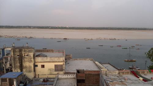 an aerial view of a body of water with a beach at MONALISA HOSTEL in Varanasi