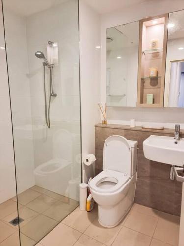 a bathroom with a toilet and a sink and a shower at Garden View of Macquarie Park Paradise in Sydney