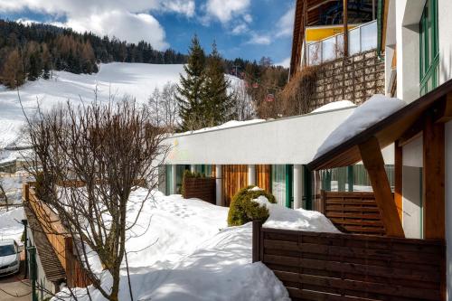 a snow covered house with a snow covered yard at Annas Garten inklusive Super Sommer Card Sommer 2026 in Serfaus