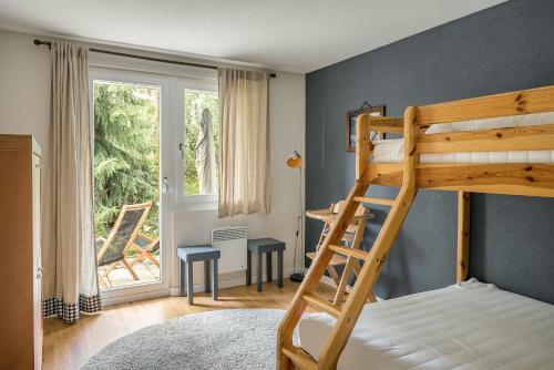 a bedroom with a bunk bed and a window at Camelot 1 in Bettmeralp