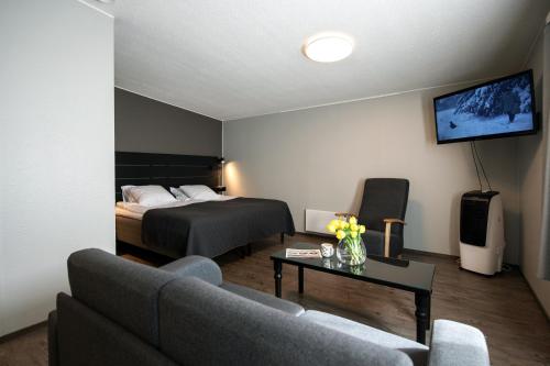 Ένα ή περισσότερα κρεβάτια σε δωμάτιο στο Koto Hotel Pihtipudas