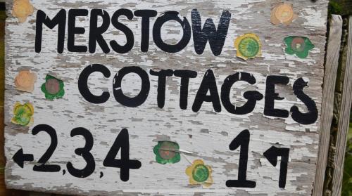 a sign for a mexican garden with a sign for at Cottage in Worcestershire in Evesham
