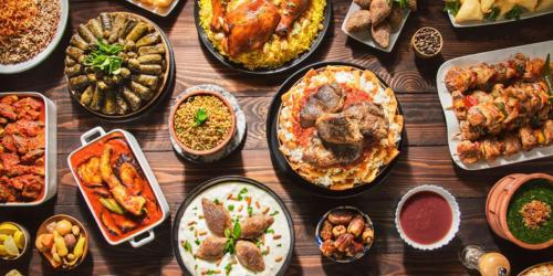 a table with many different dishes of food on it at Crowne Plaza Sohar by IHG in Sohar