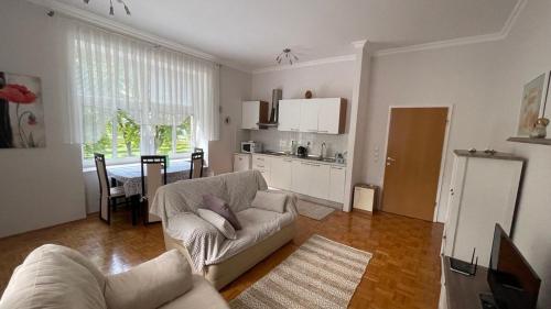 a living room with a couch and a table at Apartment Juliana in Rogaška Slatina