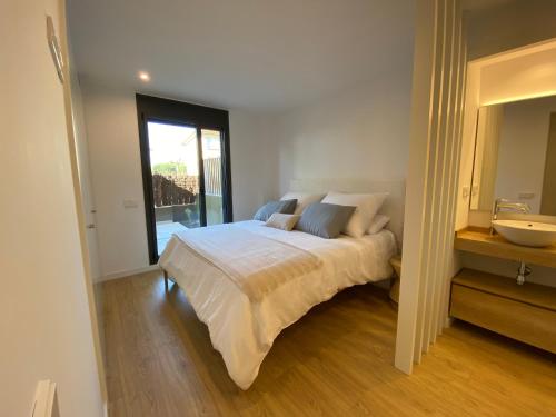 Säng eller sängar i ett rum på Apartamento nuevo, equipado y decorado con estilo