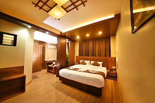a bedroom with a large bed in a room at Capital Boutique Hotel in Kathmandu