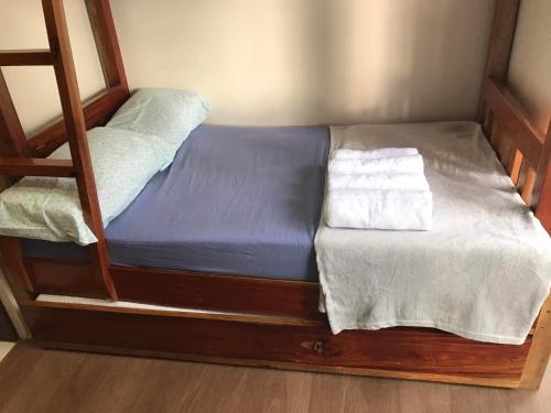 a bunk bed with two white towels on it at Moldex Residence in Baguio