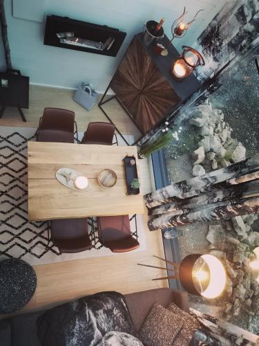 an overhead view of a living room with a table and chairs at Levi Secret Igloo Revontuli in Levi