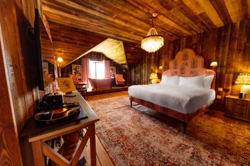 a bedroom with a bed and a desk in a room at Glasson LakeHouse in Athlone