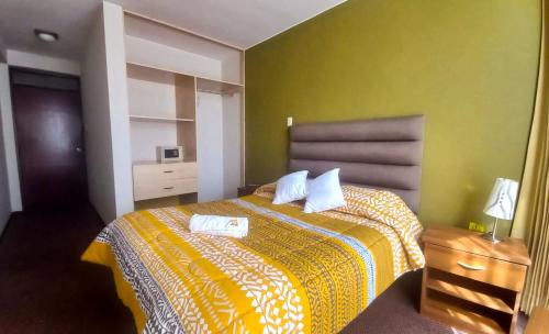 Postel nebo postele na pokoji v ubytování Hotel San Felipe Suites