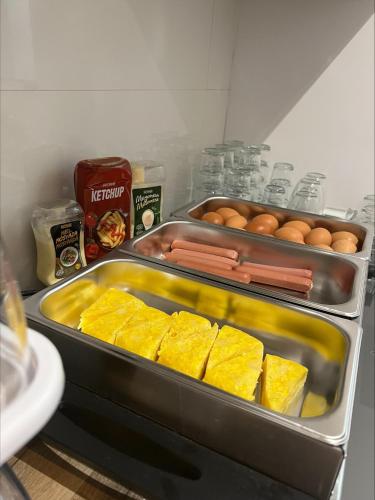 a refrigerator with some food and eggs in it at Enmathi Alicante Benalua in Alicante