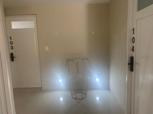 a room with a glass vase on the floor with lights at LA GRANDE MAISON in Aguascalientes