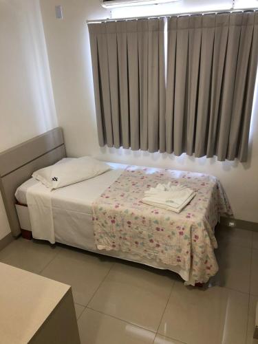 a small bedroom with a bed and a window at Hotel Pepita Palace in Sinop