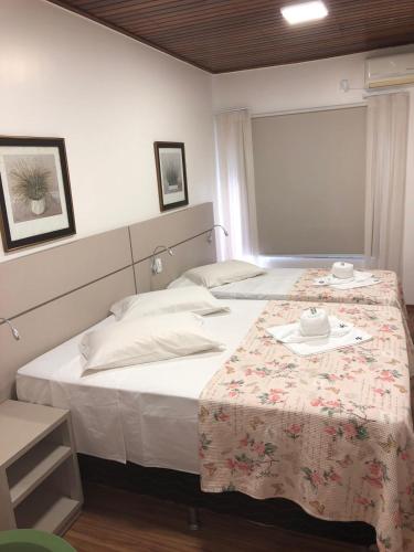 a bedroom with a bed with a table with a plate on it at Hotel Pepita Palace in Sinop