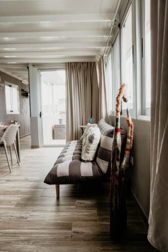 a couch sitting in the middle of a room at Casa Lara, Las Maretas in Arico