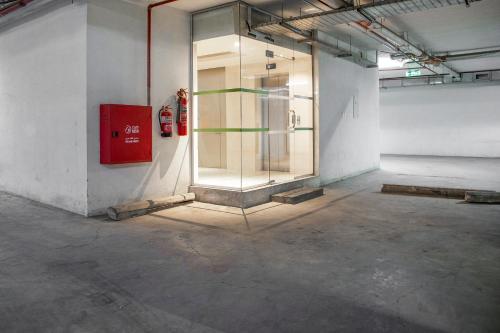 a room with a glass door in a building at Wasn Suites in Riyadh