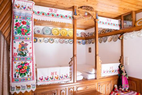 a room with two bunk beds with wooden ceilings at Astahi 