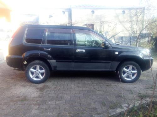 a black suv parked in a parking lot at Townhouse Maria in Kutaisi