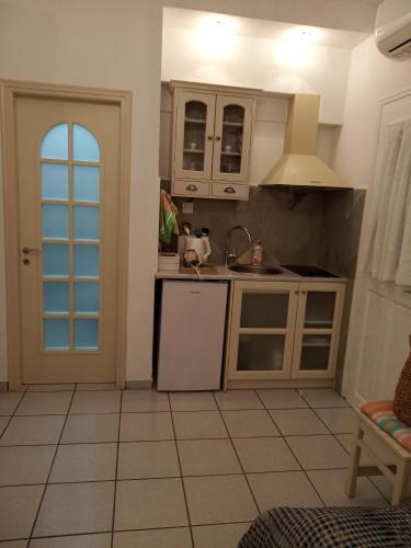 Kuchyň nebo kuchyňský kout v ubytování Giaglakis Rooms