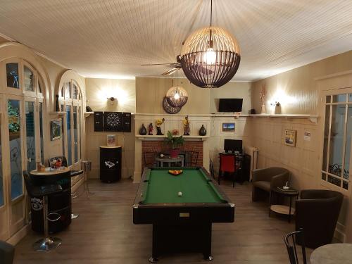 a billiard room with a pool table in it at Hotel De La Paix in Albert