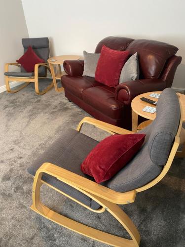 a living room with a couch and a chair at The Peel Aldergate in Tamworth