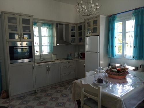 Kuchyň nebo kuchyňský kout v ubytování Giaglakis Rooms