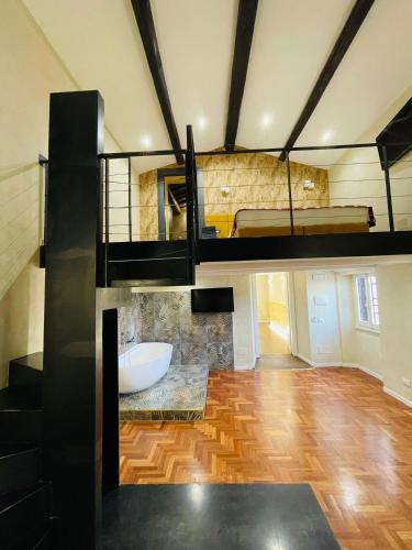 a room with a loft with a bed and a bathroom at Excellence Suite in Rome