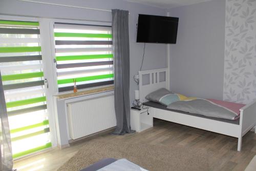 Postel nebo postele na pokoji v ubytování Ferienwohnung am Gilsbach