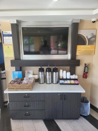a counter in a store with some food on it at Studio 6 Vallejo CA Napa Valley in Vallejo