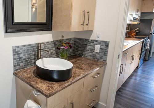 a bathroom with a sink on a counter at Downie Cottage by Revelstoke Vacations in Revelstoke