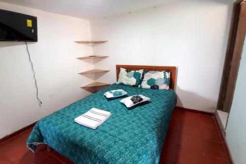 Postel nebo postele na pokoji v ubytování Posada Villa Sarita