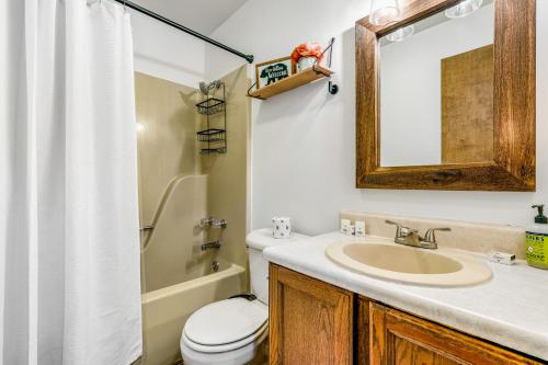 a bathroom with a sink and a toilet and a mirror at Laurel Haven in Banner Elk