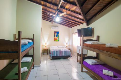 Postel nebo postele na pokoji v ubytování Geko Pousada Paraty