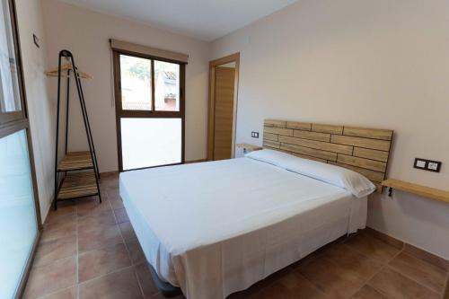 A bed or beds in a room at PLA DE LA CASA