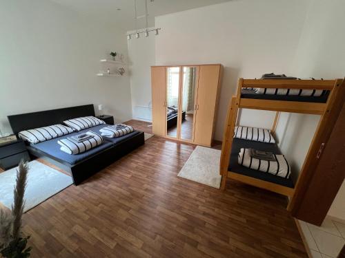 a room with two bunk beds and a couch at The Old town's apartment in Prague