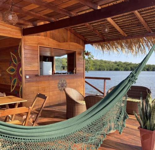 a hammock on the deck of a boat at Casa Flutuante - Experiência única in Manaus