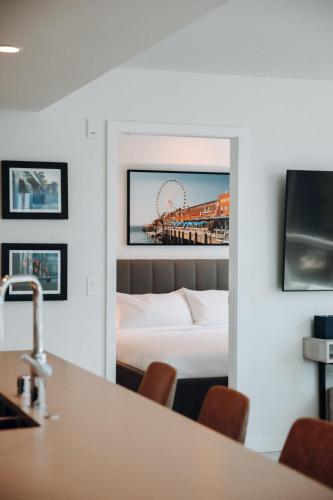 a hotel room with a bed and a pier at Level Seattle Downtown - South Lake Union in Seattle