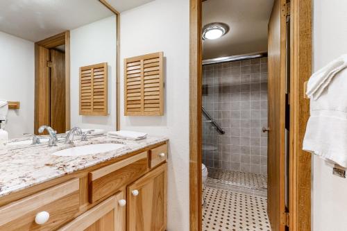a bathroom with a sink and a shower at Golf Creek 32 in Teton Village