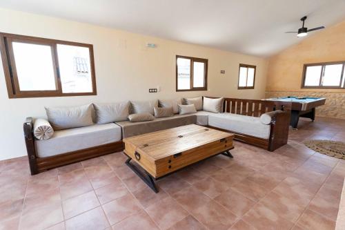 a living room with a couch and a table at CASA RURAL BIENVENIDA in Cuatretondeta